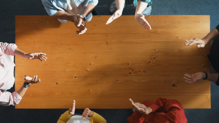 Close up of start up business people clapping hand to celebrate collaboration and increasing sales or encourage teamwork and togetherness. Business team applause to encourage investor. Convocation.の写真素材
