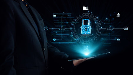 A business professional stands holding a tablet, surrounded by glowing cybersecurity icons and a...