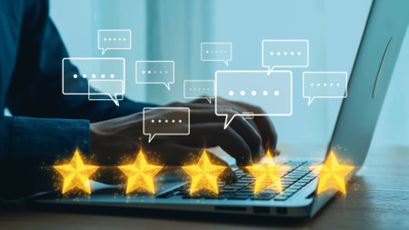 Hands typing on a laptop create a dynamic scene of feedback and customer interaction, showcasing...
