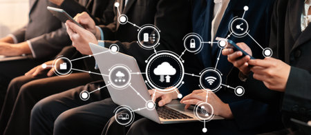 A diverse group of professionals engaged in computing with various devices showcases the essence of connectivity and innovation in a modern workspace, highlighting collaboration.の写真素材