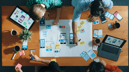 Top view of developer team sharing idea of Ux Ui design by using mind map. Top down view of group of...