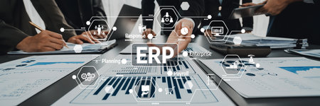 A dynamic business meeting showcasing ERP implementation strategies, with a focus on data analysis charts and collaborative teamwork in a modern office environment.の写真素材