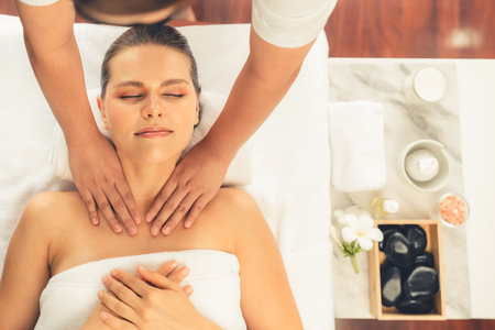 Panorama top view woman customer enjoying relaxing anti-stress spa massage and pampering with beauty skin recreation leisure in day light ambient salon spa at luxury resort or hotel. Quiescentの写真素材