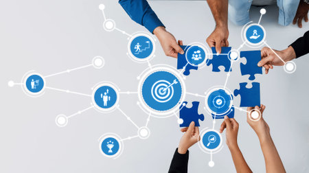 Hands of diverse individuals uniting puzzle pieces to represent collaboration and teamwork in a...