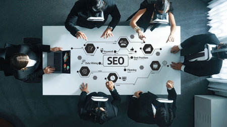 Aerial view of a corporate meeting focused on SEO strategies, showcasing professionals engaging in...