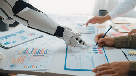 A robotic arm collaborates with a human team on business analysis, showcasing data visualization and...
