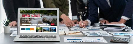 Panorama shot analyst team utilizing BI to analyze financial report with laptop. Businesspeople analyzing BI data dashboard displayed on laptop screen for business insight.の写真素材