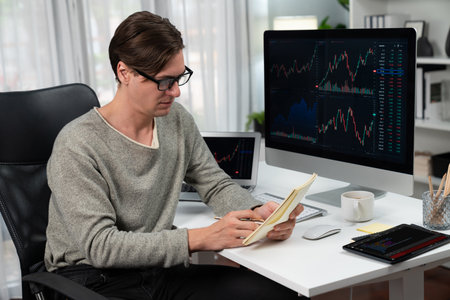 Smart businessman trader in casual day analyzing with profit value of dynamic increased stock...