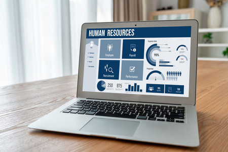 Human resources management software on computer screen helping human resources employee to manage recruitment, payroll, staff searching and KPI evaluation snuglyの写真素材