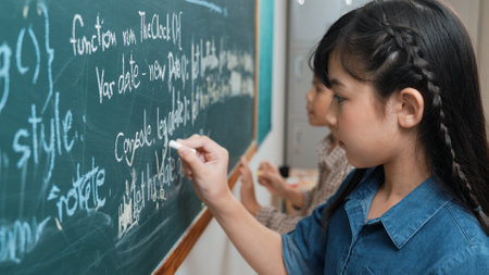 Skilled girl writing engineering prompt and programming system while standing at a blackboard with...