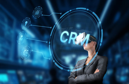 A businesswoman explores customer relationship management through virtual reality technology, enhancing interactions and strategies in an advanced, digital environment.の写真素材