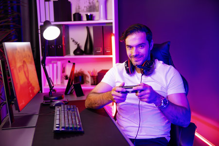 Smart gaming streamer with joystick player looking at camera, playing battle team shooting gun...