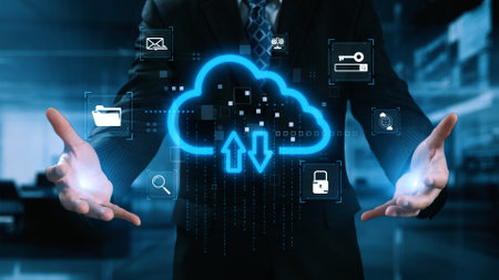 A businessman showcases a digital cloud technology concept with upload and download symbols. Various...