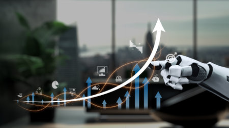 A robotic hand reaches towards dynamic data charts, symbolizing growth and innovation in a contemporary workspace. This image captures the essence of technology and advancement.の写真素材