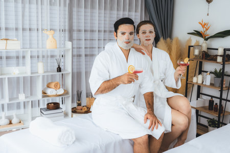 Serene modern daylight ambiance of spa salon, couple customer indulges in rejuvenating with facial skincare mask. Facial skin treatment and beauty cosmetology procedure for face. Quiescentの写真素材