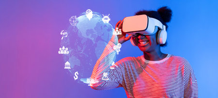 A joyful young woman engages with a virtual reality headset, immersing herself in the expanding...