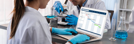 Project planning software for brisk business project management on the computer screen showing timeline chart of the team projectの写真素材