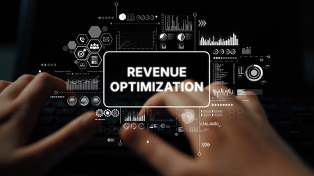 Hands Typing on a Keyboard with Graphical Data and Revenue Optimization Concept Overlayed in a Digital Workspace. Asymptotic smart data analytic.の写真素材