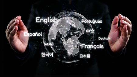 A visually striking image featuring hands delicately holding a digital globe showcasing various languages, symbolizing global communication and diversity in a modern world.の写真素材