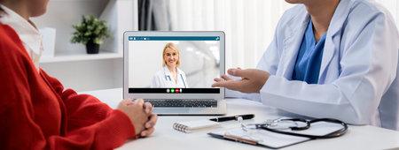 Doctor video call online by telemedicine software application for virtual meeting with patientの写真素材