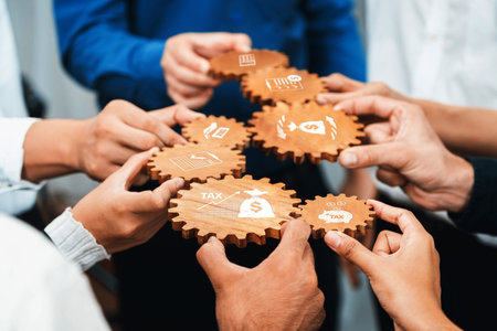 A group of diverse individuals collaborates using wooden gears to symbolize teamwork in financial...