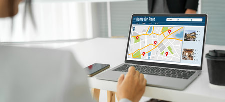 Online real estate rental search snugly on computer. House home or apartment rental website online.