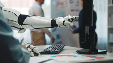 A robotic arm points at a computer screen displaying data in a contemporary office, highlighting...