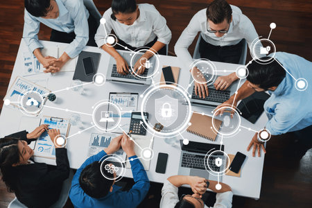 A group of professionals engages in a collaborative meeting, focusing on technology and security...