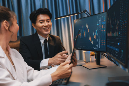 Businesswoman holding tablet on dynamic stock exchange statistic online showing to partners to...