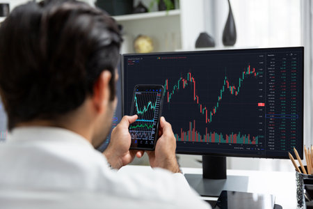 Trader businessman searching on smartphone, analyzing in dynamic stock exchange investment screen on...