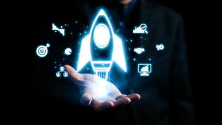 A businessman holds a glowing digital rocket in his hand, symbolizing innovation and success....