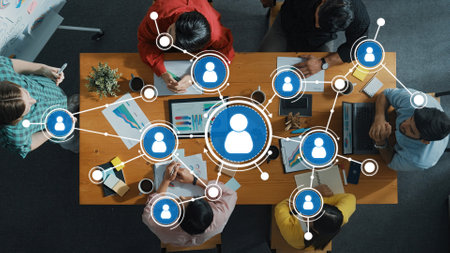 A vibrant networking session showcases diverse professionals engaged in collaborative discussions around a central figure, symbolizing teamwork and innovation.の写真素材