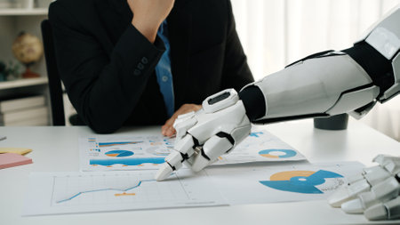 A robot arm collaborates with a businessman to review detailed data charts and graphs at an office...
