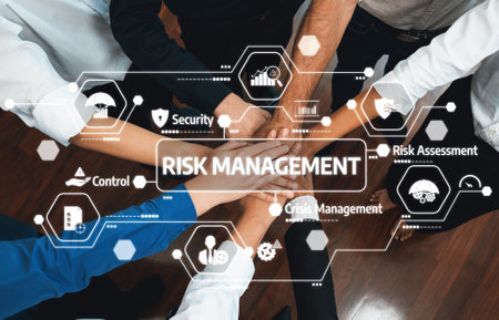 A collaborative approach to risk management is showcased with diverse hands joining in to emphasize teamwork, control, and security in organizational frameworks. Amityの写真素材