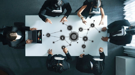 A dynamic business meeting featuring diverse professionals using virtual reality technology to brainstorm and collaborate on innovative ideas in a modern office setting.の写真素材