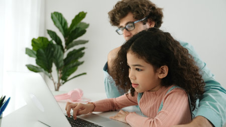 Caucasian father teaching daughter about coding engineering prompt while school girl focus on...