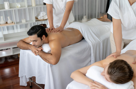 Caucasian couple customer enjoying relaxing anti-stress spa massage and pampering with beauty skin...