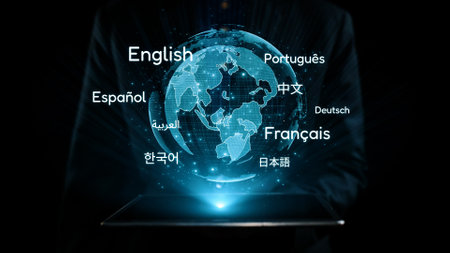 A pair of hands support a holographic globe showcasing various languages, symbolizing the importance of global communication and cultural exchange in today interconnected world. Qubitの写真素材