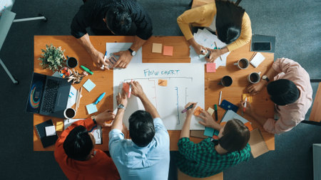 Top down aerial view of business team making scrum task board at meeting room. Group of people writing at paper and sticky notes for making kanban board to manage work flow. Top view. Convocation.の写真素材