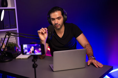 Broadcaster talking to listener on live streaming online, recording by smartphone setting on social...