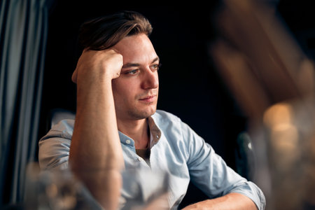 Thinking of stressful financial analyst researching on business paragraph on pc screen with dynamic...