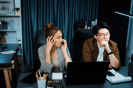 Sales managers working on desk with stretching arm up and down manner with body health ache of...