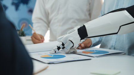 A futuristic robot arm is engaged in a business meeting, analyzing charts and graphs while team...