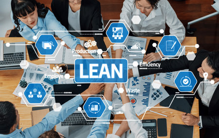 A dynamic overhead view of a diverse team engaged in lean management, emphasizing collaboration,...