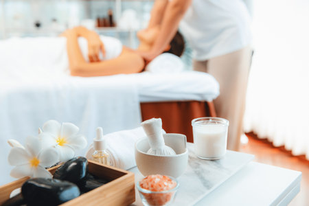 Aromatherapy massage on daylight ambiance or spa salon composition setup with focus decor and spa...