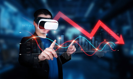 A businessman wearing virtual reality glasses interacts with dynamic graphs showcasing economic crises and market downtrends, reflecting modern data analysis techniques.の写真素材