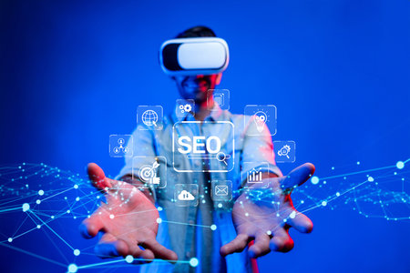 A person wearing a virtual reality headset engages with floating SEO concepts, representing the blend of technology and search engine optimization in a modern setting.の写真素材
