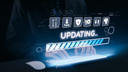 This stock photo captures hands interacting with a futuristic keyboard, featuring a holographic interface that displays a loading progress bar and an updating message.の写真素材