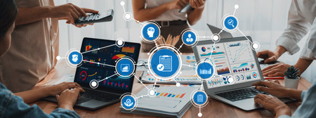 A professional team engages in a collaborative environment, utilizing modern technology and digital...