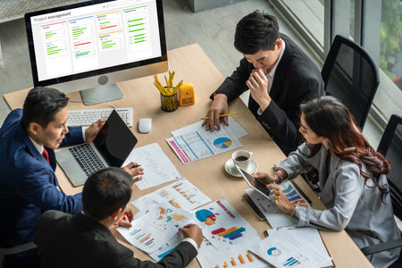 Project planning software for modish business project management on the computer screen showing timeline chart of the team projectの写真素材